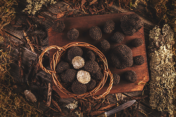Image showing Flat lay of black truffles mushrooms