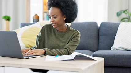 Image showing Female student studying using laptop and making notes to prepare for exams or research for college assignment. African woman highlighting information while learning and doing online course from home