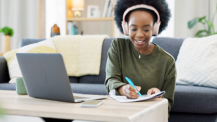 Image showing Woman talking on videocall using laptop and headphones while waving hello to friends online. Student making notes while communicating and learning new language during online course or private lesson