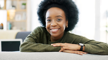 Image showing Face of a happy afro woman relaxing indoors on the weekend. Beautiful, cheerful and carefree African American girl having a stressless day at home relaxing in her modern bright living room apartment