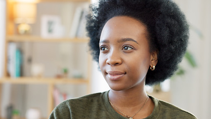 Image showing Face of a happy afro woman relaxing indoors on the weekend. Beautiful, cheerful and carefree African American girl having a stressless day at home relaxing in her modern bright living room apartment