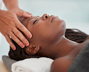 Image showing Facial massage, spa and black woman with skincare wellness, peace and calm for luxury treatment. Relax face or head of person and therapist hands for beauty, zen and healing, stress relief on table