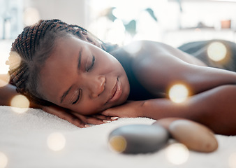 Image showing Spa, relax and sleeping woman in massage bed for wellness, peace and luxury zen. Face, female and resort rest for body care, therapy and pamper treatment, happy and smile with stress free relaxation