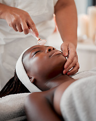 Image showing Black woman, face roller and luxury spa treatment of a young female ready for facial. Skincare, rose quartz tool and wellness clinic with client feeling calm and zen from massage and dermatology