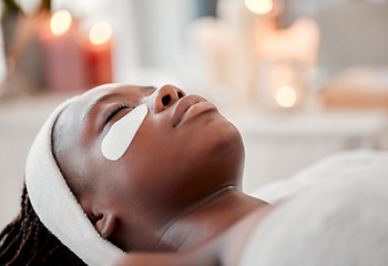 Image showing Eyes, patch and black woman face at spa, beauty and relax dermatology for aesthetic glow. Female, salon and facial eye mask product for healthy cosmetics, wellness massage or facial collagen skincare