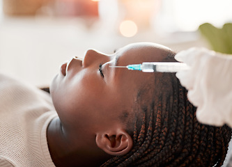 Image showing Face, needle and collagen, black woman at spa with injection for skincare and beauty treatment. Dermatology, cosmetics and person at salon with dermal syringe in skin for anti aging facial process.