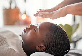 Image showing Relax, reiki and black woman with lying at spa for spiritual chakra therapy and alternative medicine. Healing, balance and zen, person with peaceful mindset and healthy mind at traditional massage.