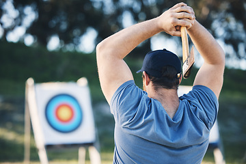 Image showing Man axe throwing at sports range, archery training or practice with board circle for action, game and fitness. Strong person with weapon for tomahawk competition, gaming and park or field with target