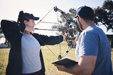 Image showing Archery, bow and arrow with woman and coach, aim at target with sports outdoor, combat training and weapon. Coaching, learning and teaching with female and man at shooting range, archer and help