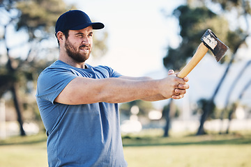 Image showing Sports, archery and man throw axe on range for training, exercise and target practice competition. Extreme sport, fitness and male archer aim with tomahawk weapon for action, games and adventure