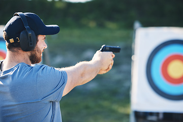 Image showing Man, firearm training and target for outdoor challenge, goals and aim for police, army or security academy. Shooting expert, pistol or gun for sport, safety and combat exercise in nature with vision