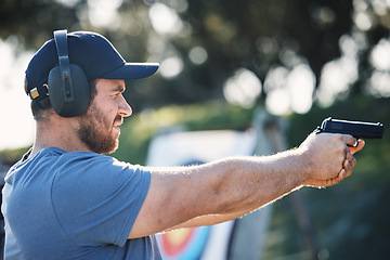 Image showing Man, gun training and target for outdoor challenge, goals and aim for police, army or security academy. Shooting expert, pistol or firearm for sport, safety and combat exercise in nature with vision