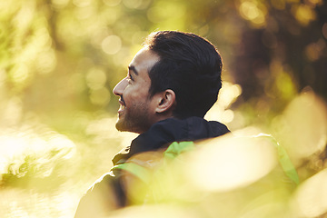 Image showing Happy man, backpacker or hiking in forest woods, trekking in nature on summer adventure, relax workout or fitness exercise. Face, smile or hiker in bokeh environment for healthcare wellness