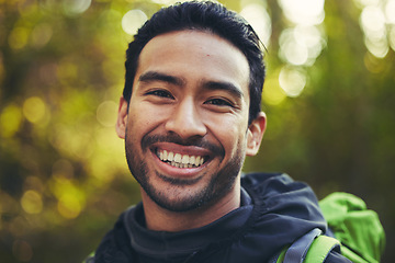 Image showing Asian man, portrait or hiking in nature forest, trekking woods or trees environment for adventure, workout or fitness exercise. Smile, happy or training hiker face in travel freedom or fun adventure