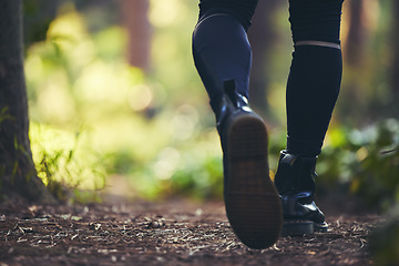 Image showing Walking man, legs and hiking in forest, nature woods or trail for adventure, workout or fitness exercise. Zoom, feet or hiker shoes on environment path for healthcare, cardiology wellness or freedom