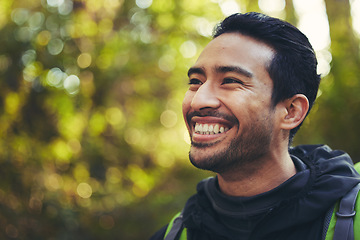 Image showing Japanese man, backpacker and hiking in nature forest, trekking woods or trees in adventure, workout or fitness exercise. Smile, happy and environment hiker for travel freedom or healthcare wellness