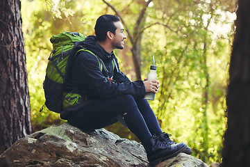 Image showing Relax, hiking or water bottle in forest, nature woods or fitness environment for break, electrolytes or healthcare wellness. Hiker man, backpacker or sports drink in rest, recovery or thirsty workout