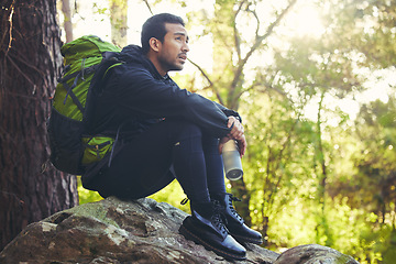 Image showing Tired, hiking or water bottle in woods, nature forest or fitness environment for relax, electrolytes or Japanese healthcare. Hiker man, backpacker or sports drink in rest, recovery or fatigue break