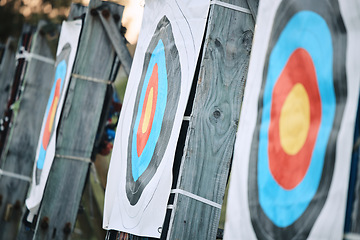 Image showing Bullseye target paper, outdoor and field at shooting range for weapon training, aim and accuracy. Sports, archery and poster for gun, bow and arrow at academy for police, army or security for goal