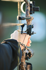 Image showing Sports archer, hands and bow and arrow training for archery competition, athlete challenge or girl field practice. Shooting, talent and competitive woman focus on precision, aim or outdoor objective