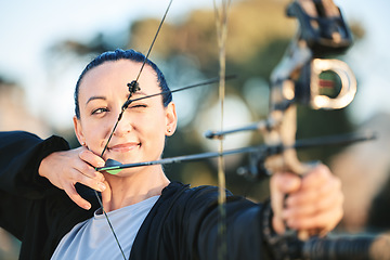 Image showing Archery bow, woman aim and shooting range for competition, game or practice at an outdoor sports or park. Hunter or person face with arrow for gaming, adventure and hunting with focus on target