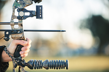 Image showing Archery bow and closeup of person at shooting range for competition, game or learning in field or outdoor sports. Woman and arrow for gaming, adventure and sport hunting with aim and target practice