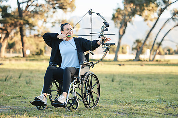 Image showing Disabled woman, outdoor archery in wheelchair and challenge with active sports lifestyle in Canada. Person with disability in a park, fitness activity to exercise arms and aim arrow for hobby