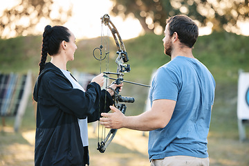 Image showing Target, training and archery woman with an instructor on field for hobby, aim and control. Arrow, practice and archer people together outdoor for hunting, precision and weapon in shooting competition