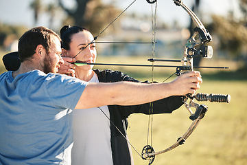 Image showing Archery, aim and shooting range sports training with a woman and man outdoor for target practice. Archer and athlete person with focus on field for competition or game with bow and arrow for action