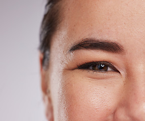 Image showing Smile, skincare and half portrait of woman with eye zoom, glowing skin and natural beauty makeup in studio. Dermatology, advertising and luxury cosmetics, face of model isolated on studio background.