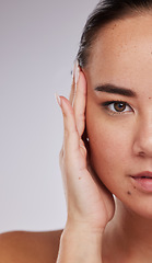 Image showing Skincare, portrait and woman in studio for beauty, grooming and cosmetic on grey background. Face, half and closeup of asian girl model relax, eye lift and botox or anti aging skin treatment isolated