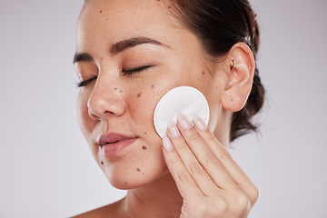 Image showing Skincare cotton, face and woman with eyes closed in studio isolated on gray background. Makeup hygiene, beauty aesthetics and closeup of female model with facial pad or product for cleaning cosmetics