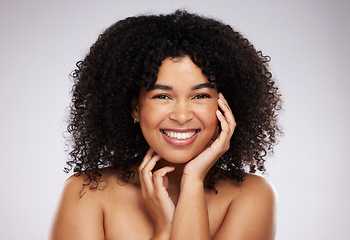 Image showing Portrait, skincare and afro with a model black woman in studio on a gray background for natural hair treatment. Face, beauty and haircare with an attractive young female posing to promote cosmetics