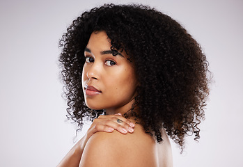 Image showing Black woman, hair and afro in studio portrait with beauty, wellness and cosmetic skincare glow by background. Young gen z model, african and cosmetics with clean face, natural and healthy aesthetic