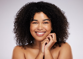 Image showing Portrait, beauty and hair with a biracial woman in studio on a gray background for natural afro treatment. Face, skincare and haircare with an attractive young female posing to promote cosmetics