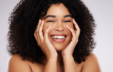 Image showing Portrait, skincare and afro with a black woman in studio on a gray background for natural hair treatment. Face, beauty and haircare with an attractive young female model posing to promote cosmetics