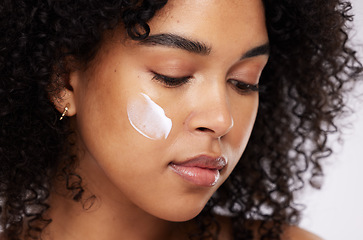 Image showing Skincare, cream and face of black woman for beauty, wellness and healthy skin in studio. Dermatology, luxury spa and girl with lotion, creme or moisturizer for makeup, cosmetics and facial treatment