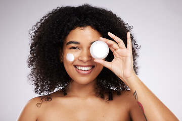 Image showing Beauty, cream product and portrait of black woman for skincare, wellness and healthy skin in studio. Dermatology, luxury spa and happy girl with face lotion for makeup, cosmetics and facial treatment