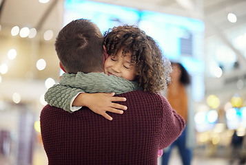 Image showing Family, dad and child hug at airport, travel and girl greeting man after flight, happiness and love with luggage at terminal. Happy, care and bond with trip, bag and welcome home with reunion