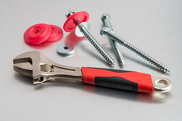 Image showing Spanner tool and screws