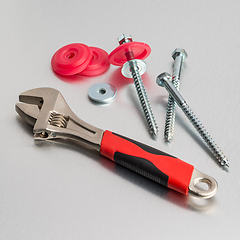 Image showing Spanner tool and screws