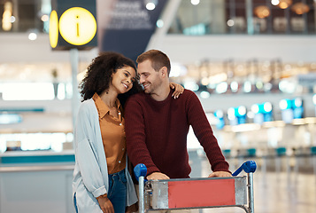 Image showing Travel, airport and couple with smile, luggage and suitcase for holiday, vacation and global adventure. Plane transport, love and interracial man and woman happy, excited and hug waiting for flight