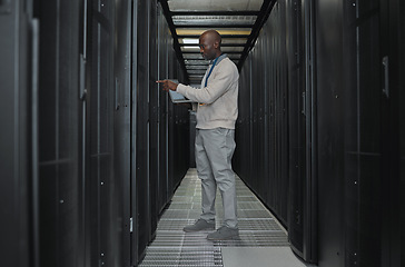 Image showing Laptop, maintenance and server room with IT black man for research, engineer working in dark data center. Computer, cybersecurity and analytics with male programmer problem solving or troubleshooting