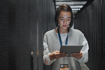 Image showing Tablet, server room and cloud computing with a programmer asian woman at work on a mainframe. Software, database and information technology with a female coder working alone on a cyber network