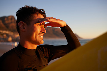 Image showing Sunset, surfer and man with view, fitness and happiness with summer vacation, workout and exercise. Male, athlete and happy guy with sunshine, beach or holiday on tropical island, wellness or freedom