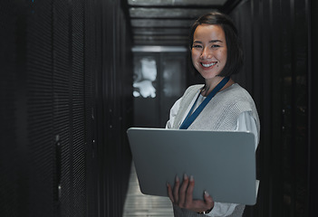 Image showing Woman with laptop, server room and information technology, smile in portrait with engineer and datacenter Software update, cybersecurity and network with Asian female setting up firewall and database