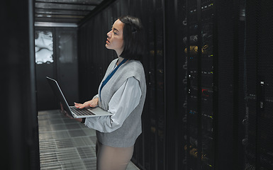 Image showing Server room, laptop and young woman or technician in data center management, system and cyber security. Thinking, serious and inspection of asian electrician, engineer or programmer person code check