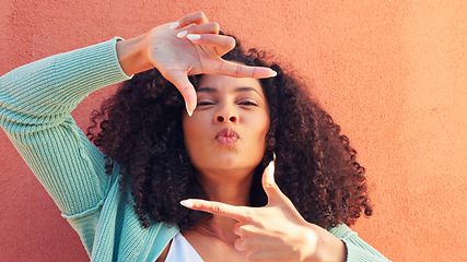 Image showing Happy black model, funny frame face on wall background and portrait smile in sunshine. Young african woman laugh at zoom focus gesture, ready for closeup and crazy creative photography idea with afro