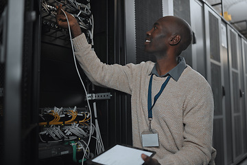 Image showing Engineer, server room and black man with cable and tablet for database maintenance or software update. Cybersecurity, it or startup male coder on tech for programming or networking in data center