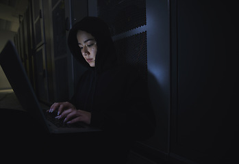 Image showing Hacking, server room and woman computer coding, data center crime and ransomware of cyberpunk in dark. Laptop hacker, person or thief in cybersecurity, information technology and criminal programmer